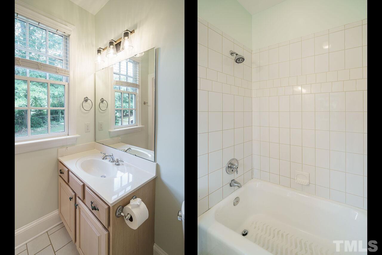 3201 Landor Road Raleigh, NC 27609 - Photo 30 of 41 a bathroom with a tub sink and mirror