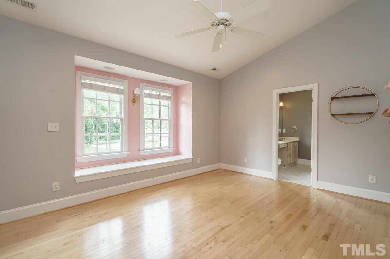 3201 Landor Road Raleigh, NC 27609 - Photo 31 of 41 a view of an empty room with wooden floor and a window