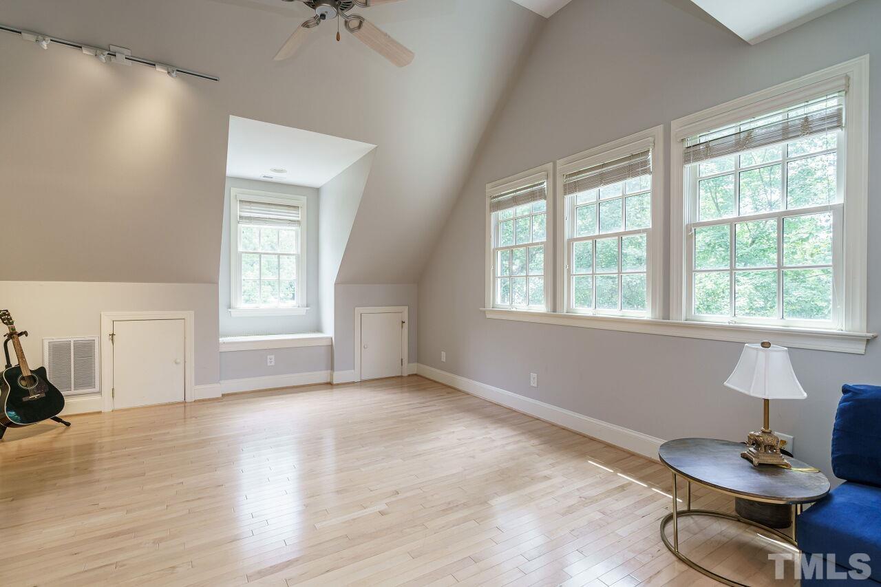 3201 Landor Road Raleigh, NC 27609 - Photo 33 of 41 a view of a livingroom with furniture window and wooden floor