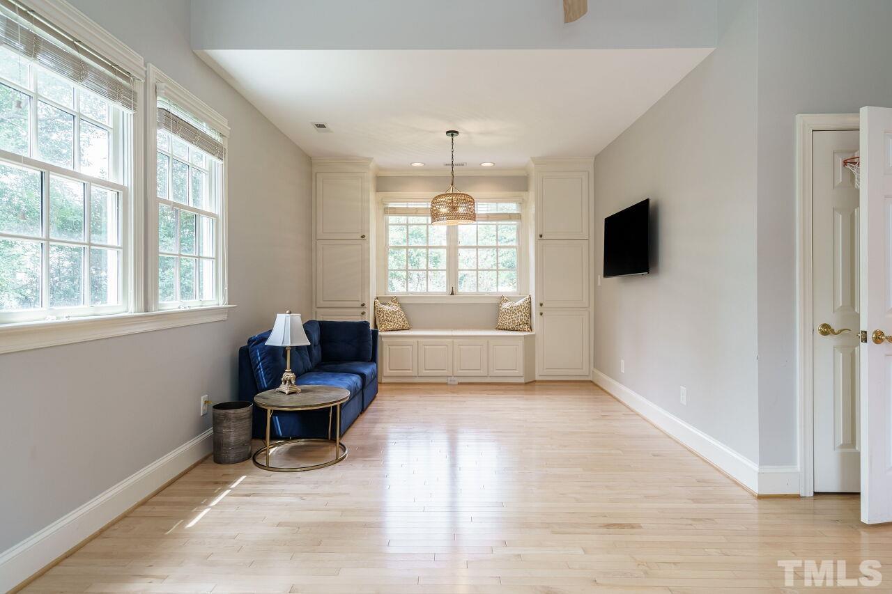 3201 Landor Road Raleigh, NC 27609 - Photo 35 of 41 a living room with furniture and a flat screen tv