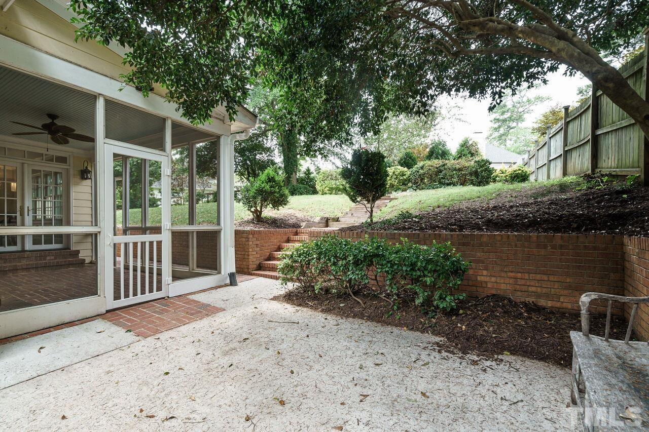 3201 Landor Road Raleigh, NC 27609 - Photo 37 of 41 a backyard of a house with lots of green space
