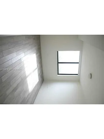 a black and white photo of a living room
