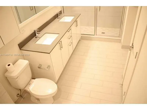 a bathroom with a sink and toilet