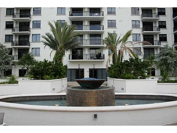 a view of a potted plant in front of a building