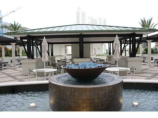 a view of a table and chairs in the patio