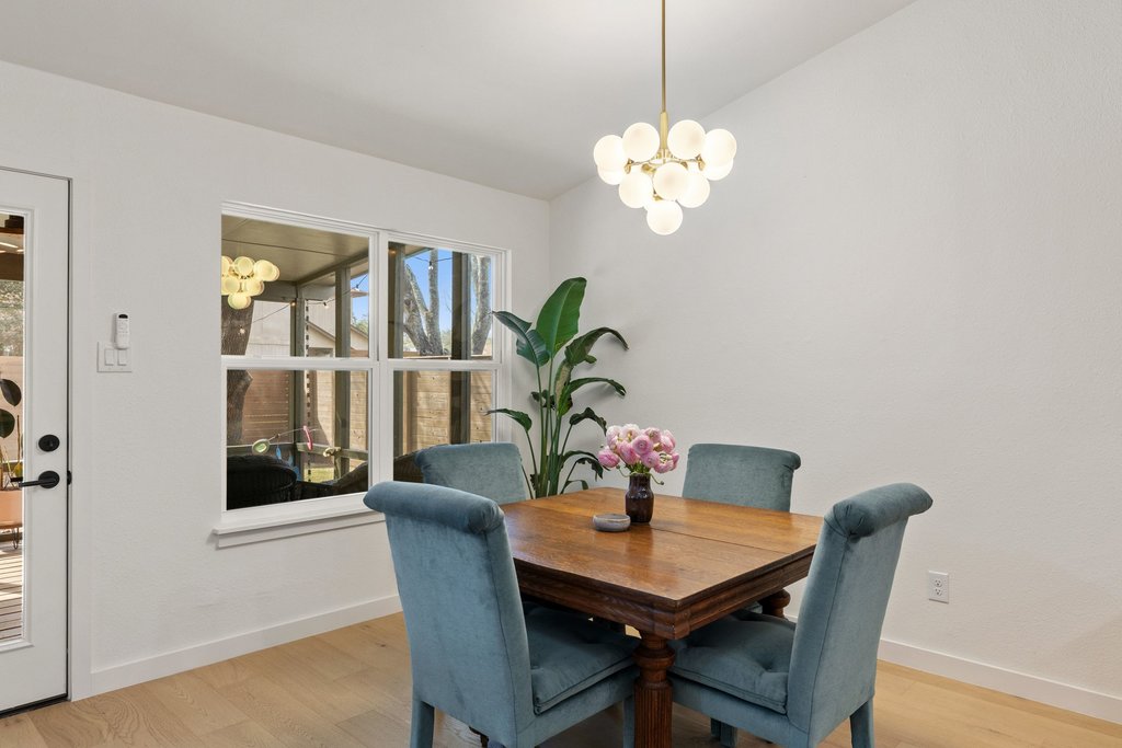8202 Cache Drive Austin, TX 78749 - Photo 11 of 39 a view of a dining room with a table and chairs