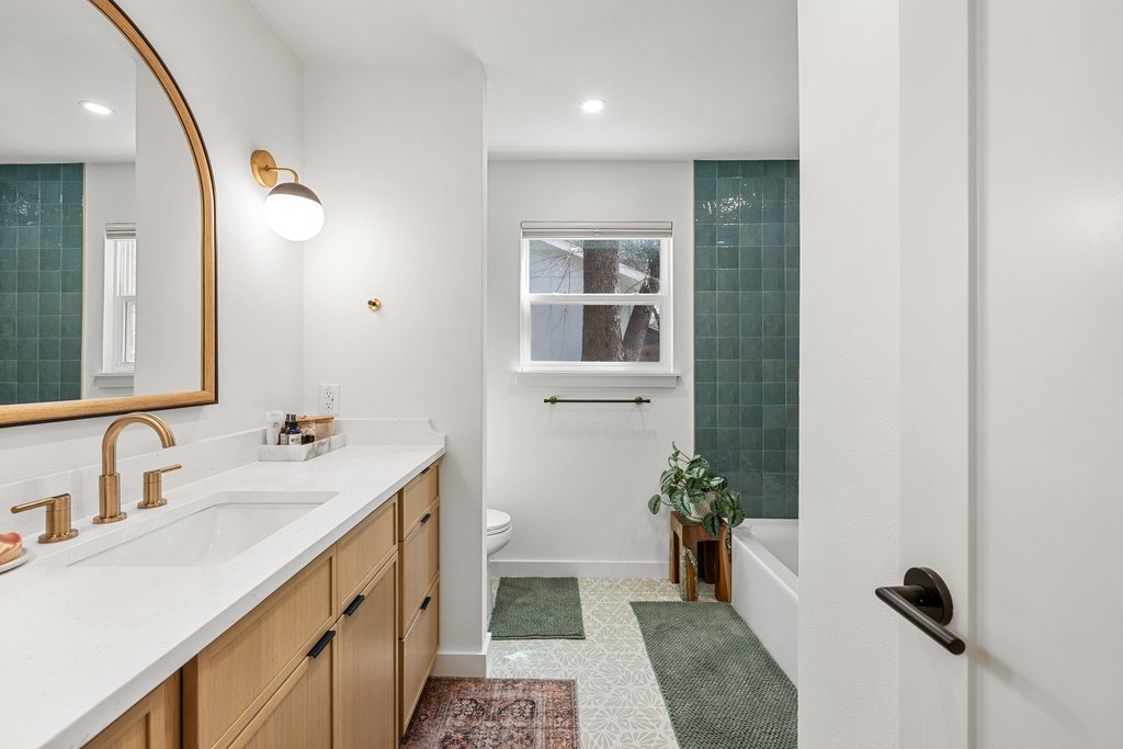 8202 Cache Drive Austin, TX 78749 - Photo 23 of 39 a bathroom with a sink a toilet and shower