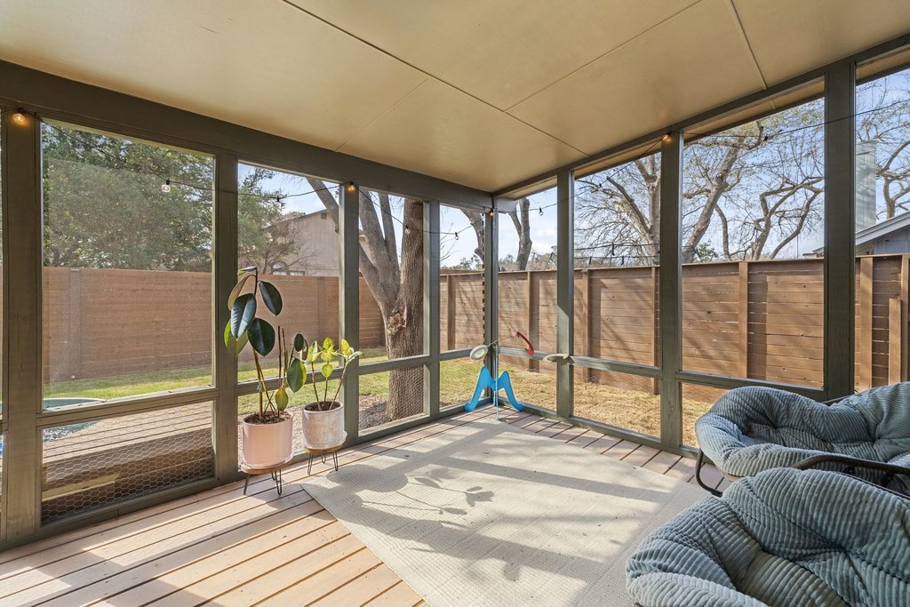 8202 Cache Drive Austin, TX 78749 - Photo 26 of 39 a bedroom with furniture and a large window