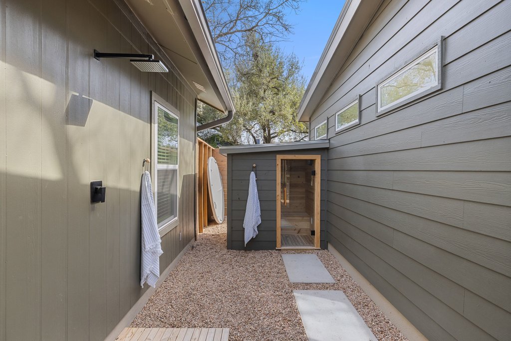 8202 Cache Drive Austin, TX 78749 - Photo 31 of 39 a view of a house with a door and wooden walls