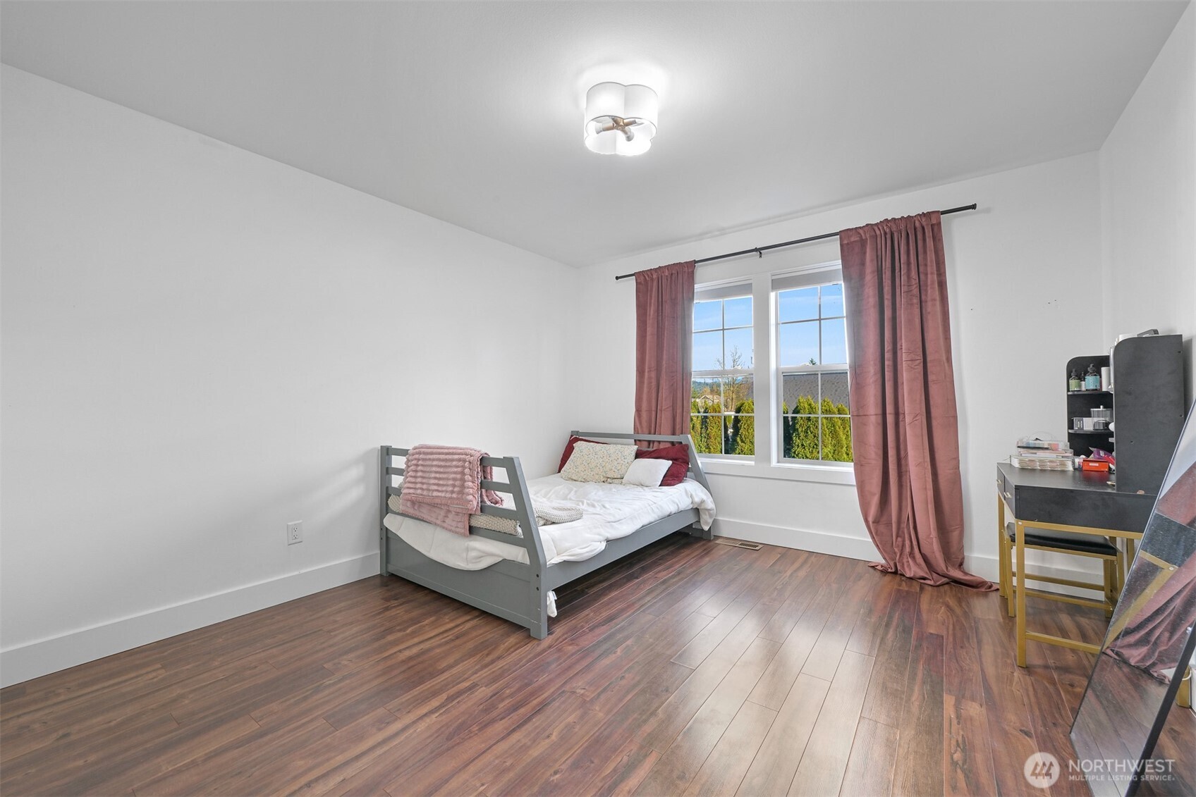 109 West 2nd Street Nooksack, WA 98276 - Photo 23 of 36 a bedroom with furniture and a wooden floor