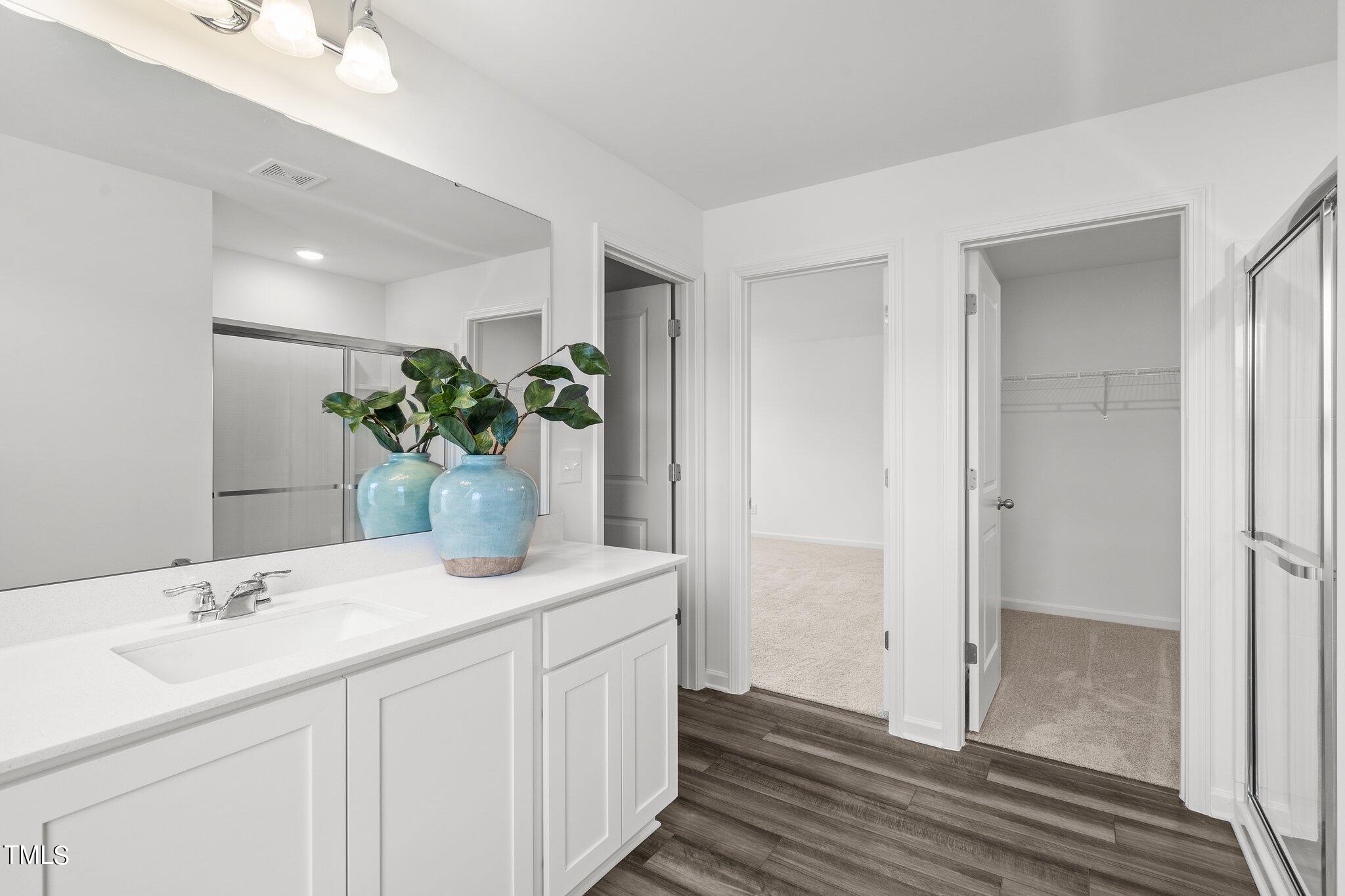 326 Spaight Acrs Way Wake Forest, NC 27587 - Photo 12 of 39 a bathroom with a sink and a mirror