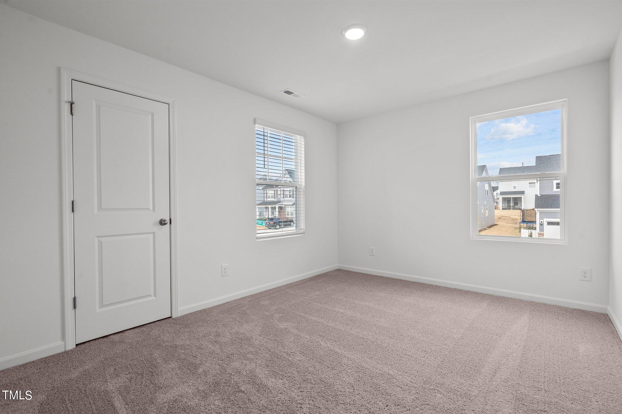 326 Spaight Acrs Way Wake Forest, NC 27587 - Photo 17 of 39 a view of an empty room with a window