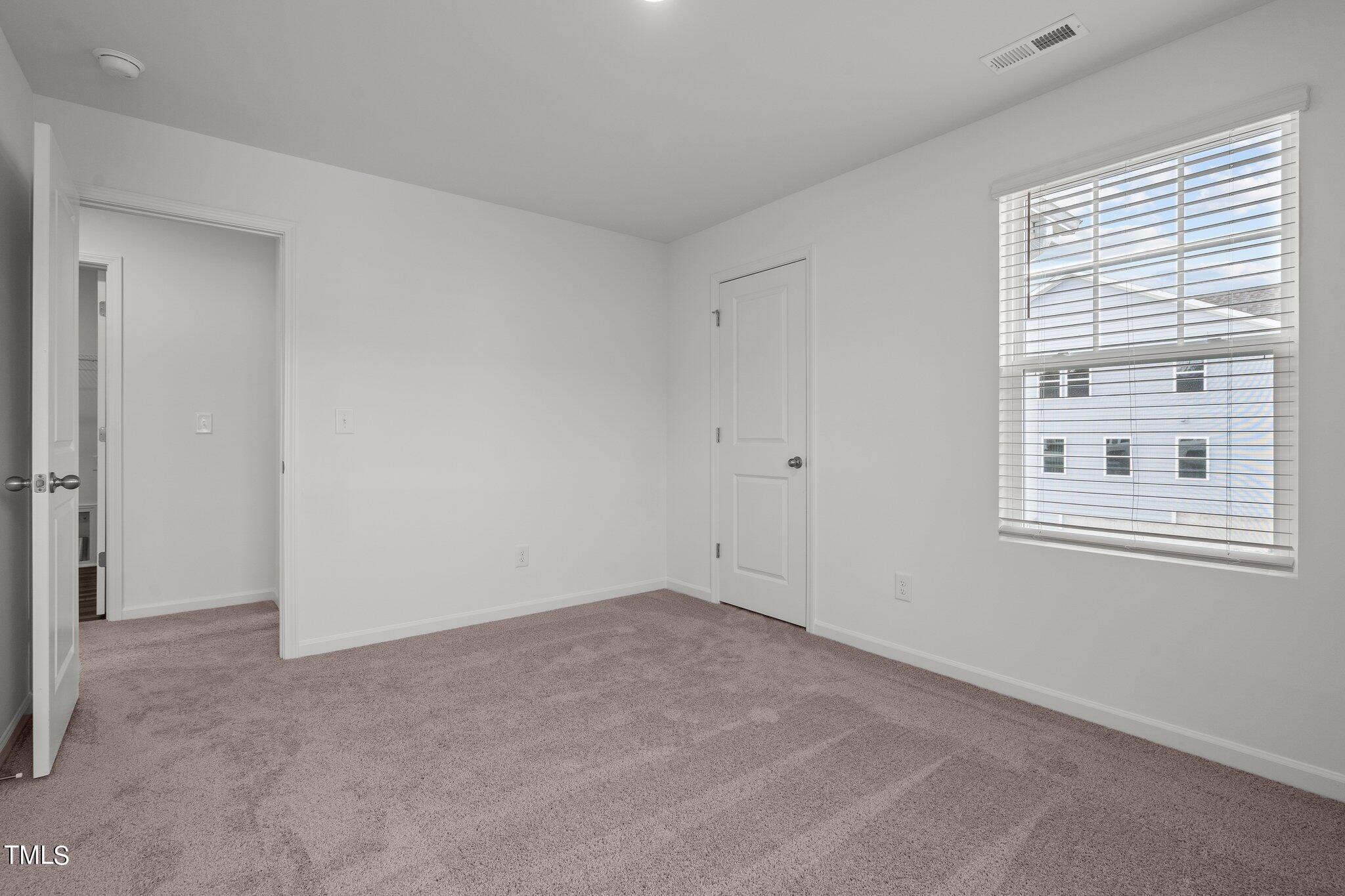 326 Spaight Acrs Way Wake Forest, NC 27587 - Photo 18 of 39 a view of empty room with windows