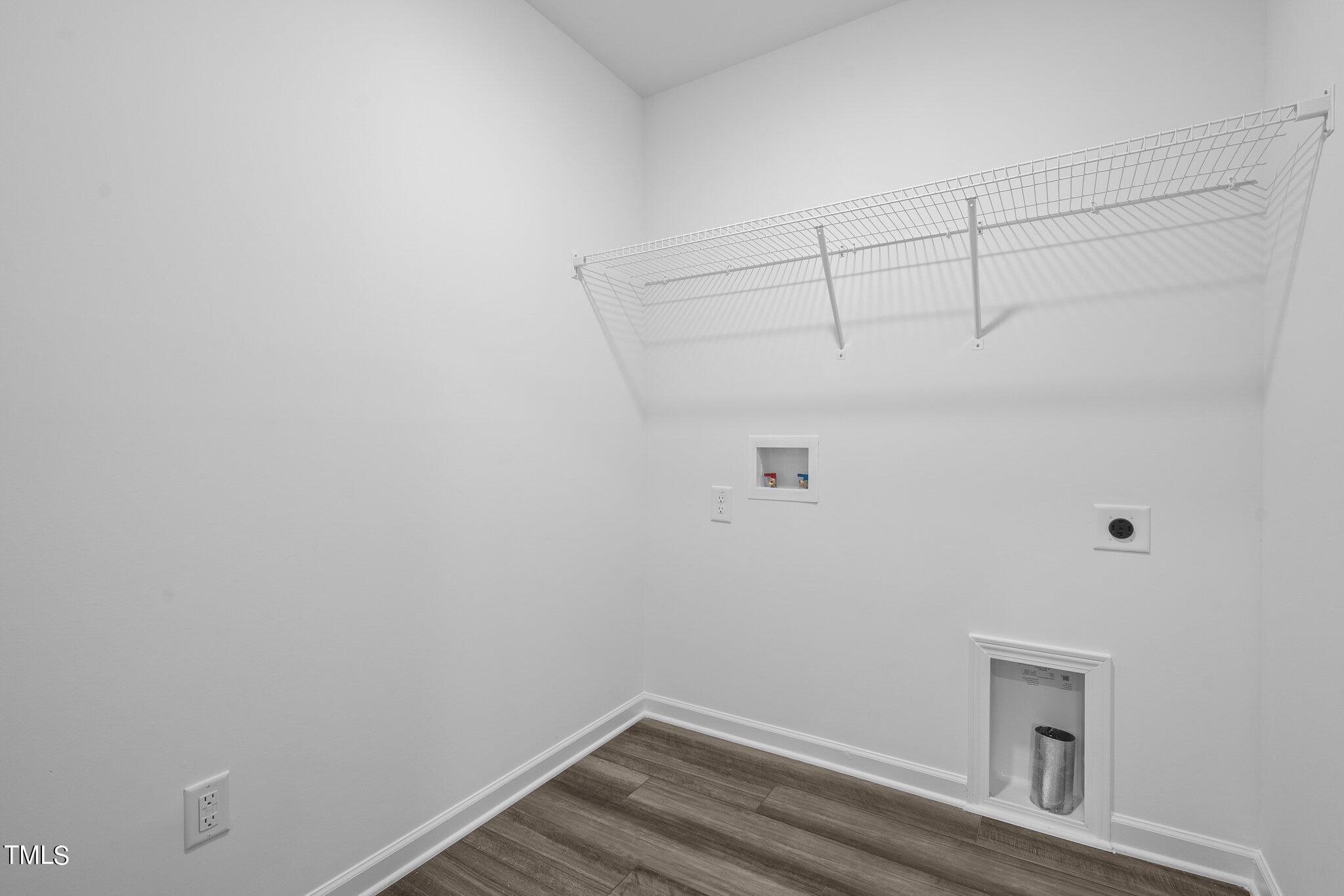 326 Spaight Acrs Way Wake Forest, NC 27587 - Photo 23 of 39 a view of a room with racks on the wall