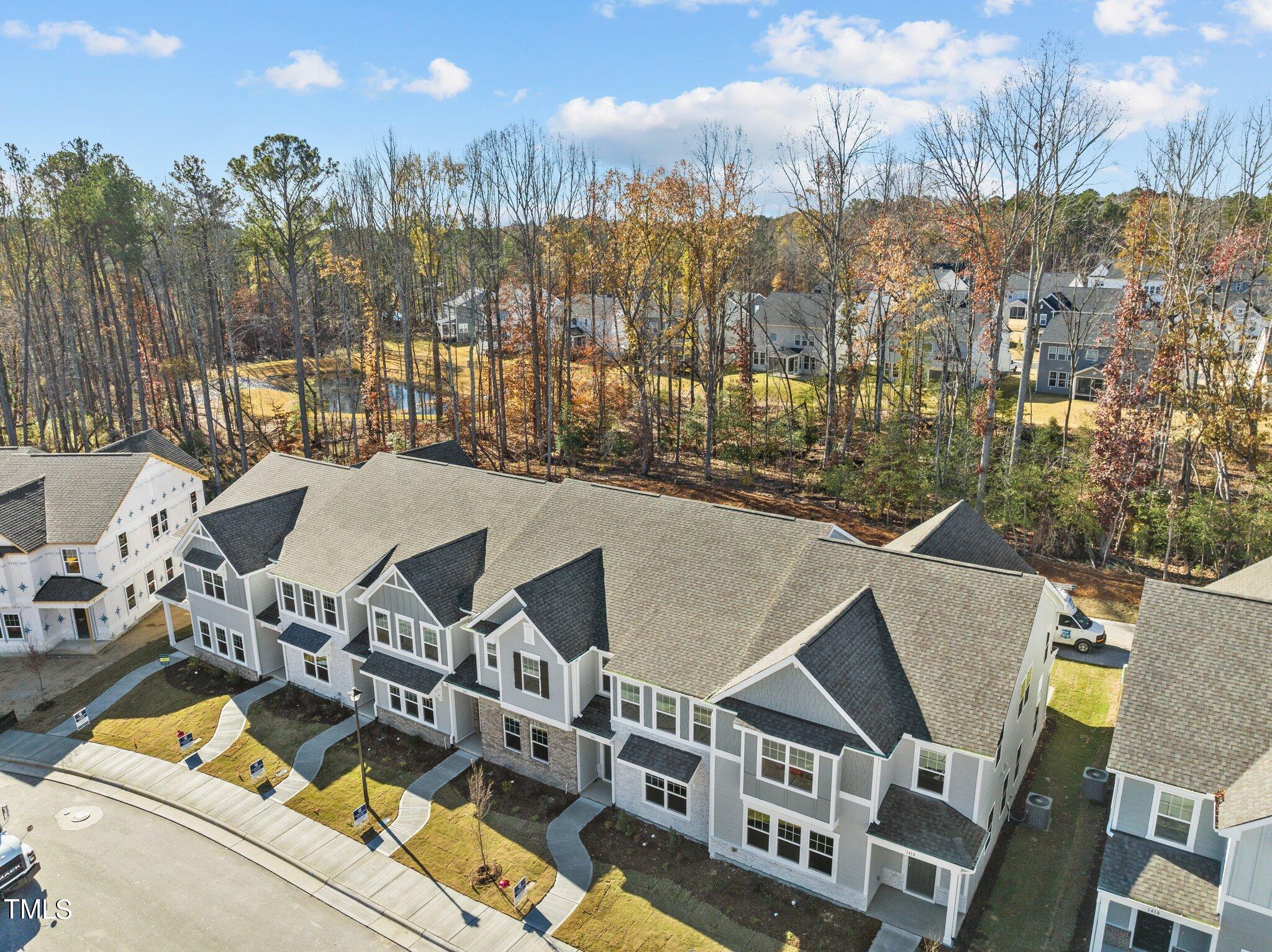 326 Spaight Acrs Way Wake Forest, NC 27587 - Photo 27 of 39 a view of a building with a outdoor space