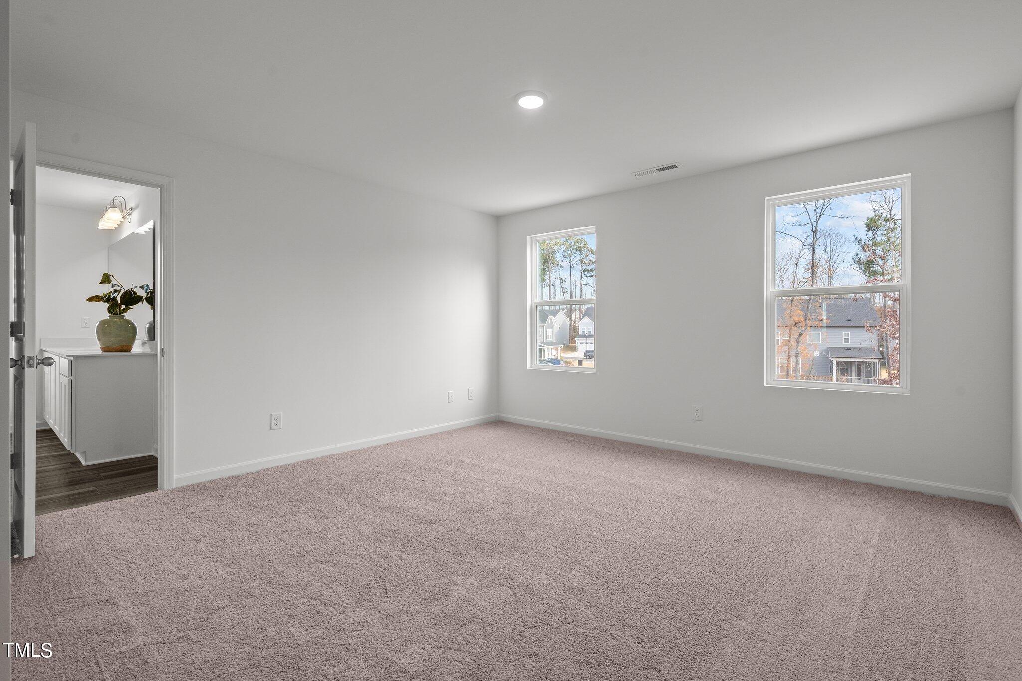 326 Spaight Acrs Way Wake Forest, NC 27587 - Photo 10 of 39 an empty room with windows and closet