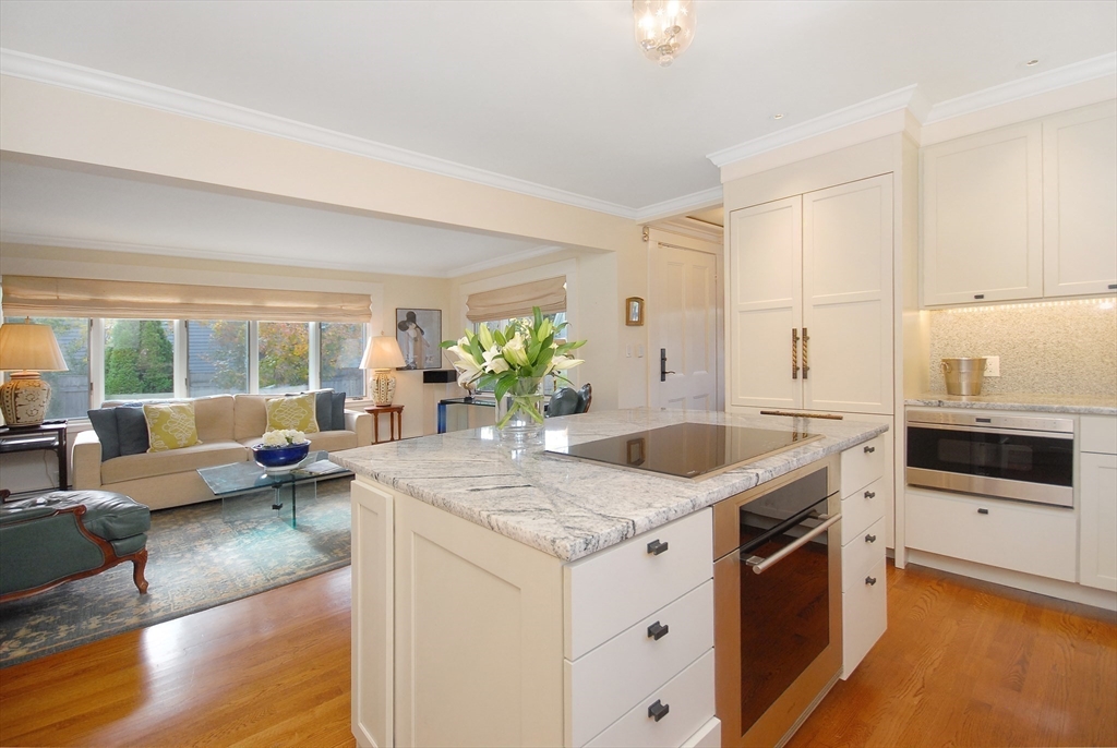 46 Sudbury Road Concord, MA 01742 - Photo 12 of 41 a kitchen with stainless steel appliances granite countertop a sink and a stove