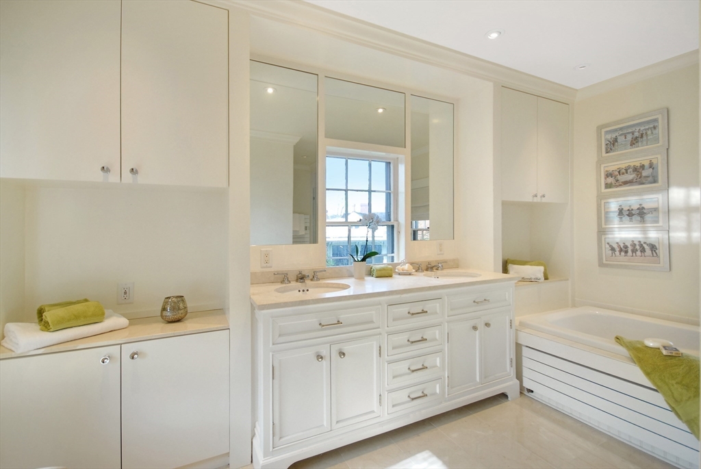 46 Sudbury Road Concord, MA 01742 - Photo 24 of 41 a spacious bathroom with a granite countertop sink mirror and bathtub