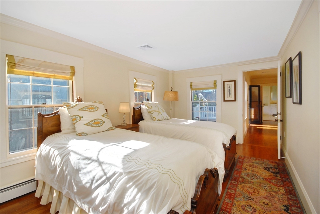 46 Sudbury Road Concord, MA 01742 - Photo 27 of 41 a bed room with two bed and a large window