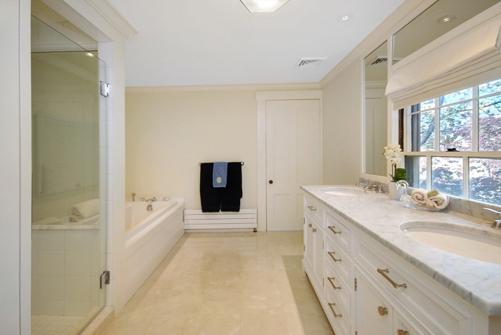46 Sudbury Road Concord, MA 01742 - Photo 28 of 41 a spacious bathroom with a tub sink and mirror