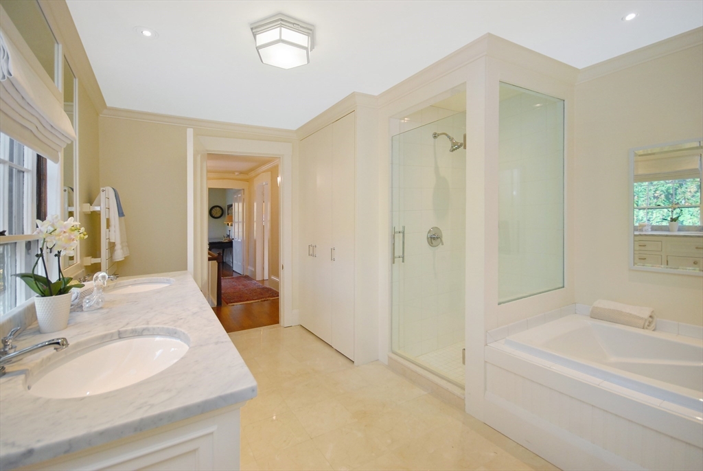 46 Sudbury Road Concord, MA 01742 - Photo 29 of 41 a spacious bathroom with a granite countertop sink a toilet and shower