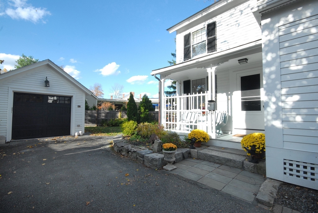 46 Sudbury Road Concord, MA 01742 - Photo 33 of 41 a backyard of a house with outdoor seating