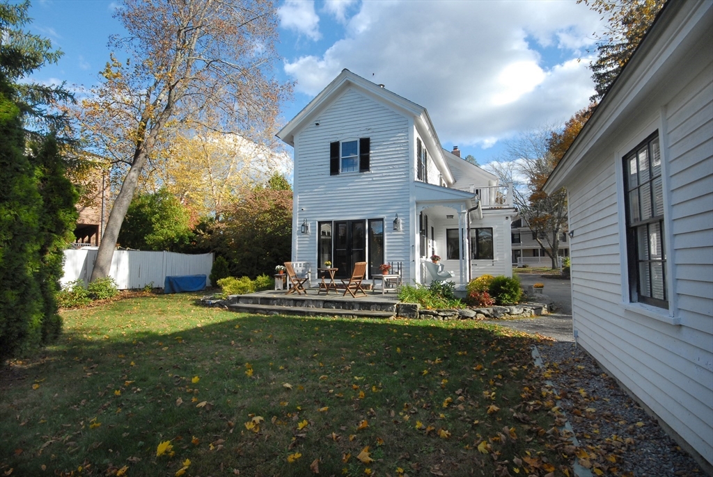 46 Sudbury Road Concord, MA 01742 - Photo 36 of 41 a front view of house with outdoor seating and yard