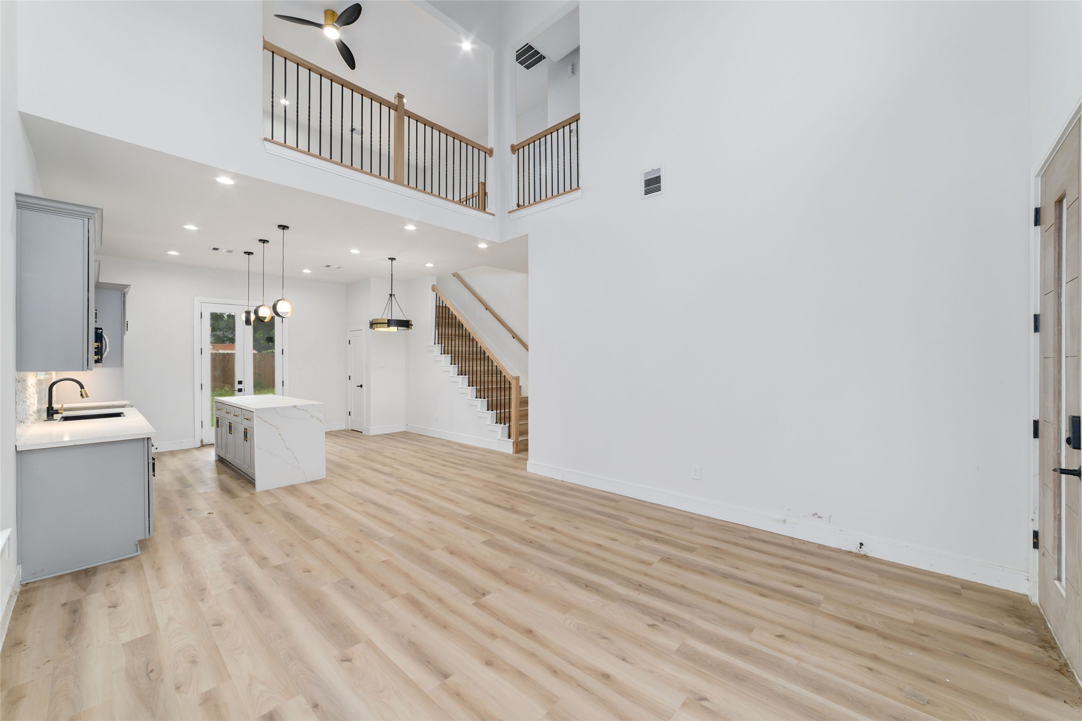 6717 England Street Houston, TX 77021 - Photo 3 of 25 a view of entryway and hall with wooden floor