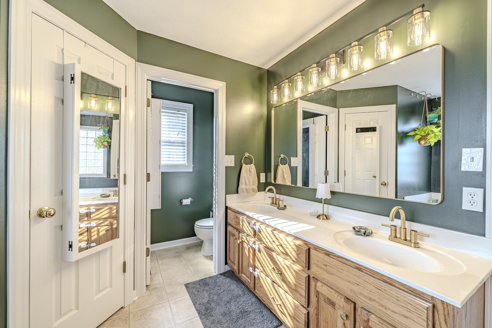 270 2 Boys Road Savannah, TN 38372 - Photo 19 of 35 Full bath featuring double vanity and light tile patterned floors