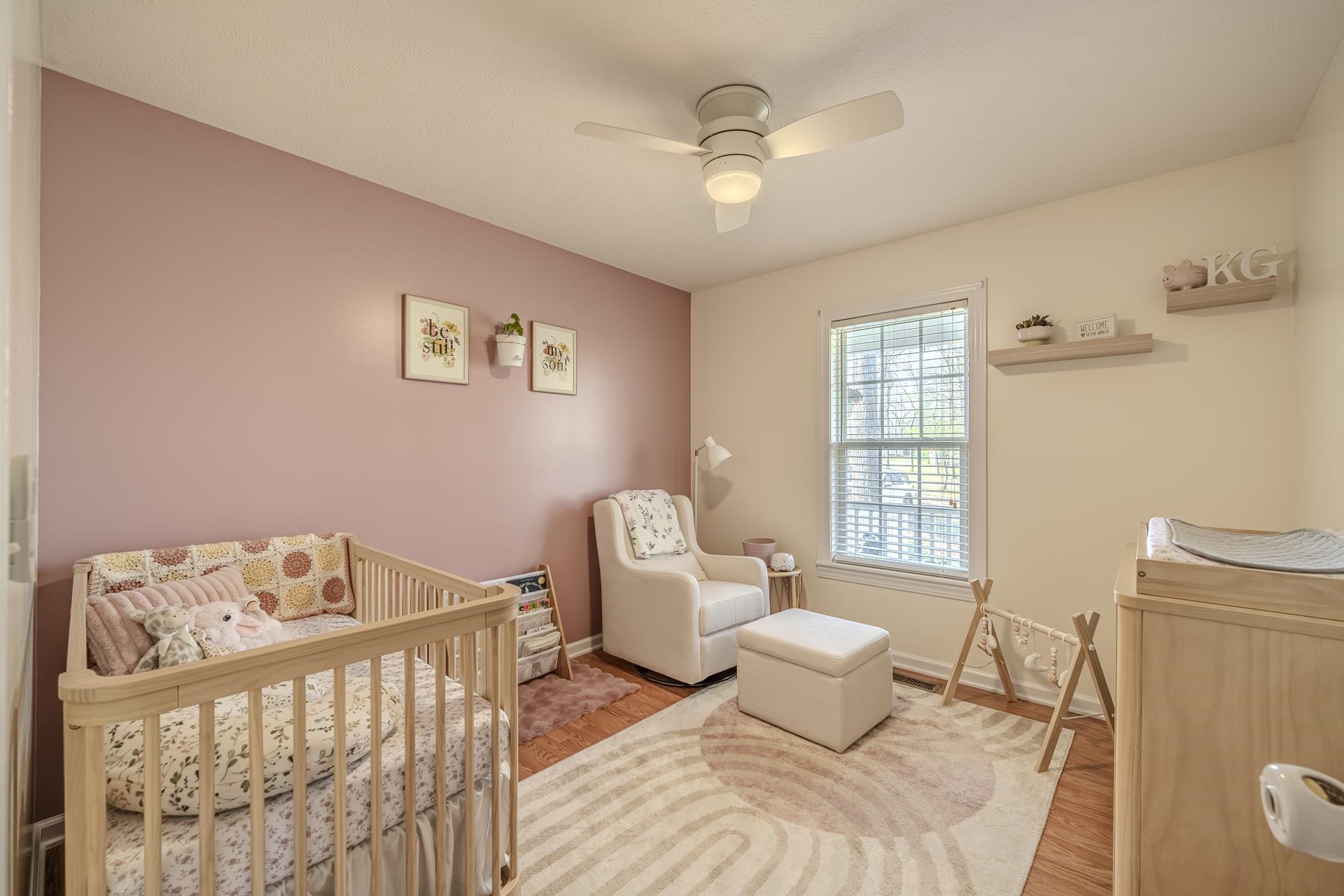 270 2 Boys Road Savannah, TN 38372 - Photo 21 of 35 Bedroom with a crib, wood finished floors, and ceiling fan
