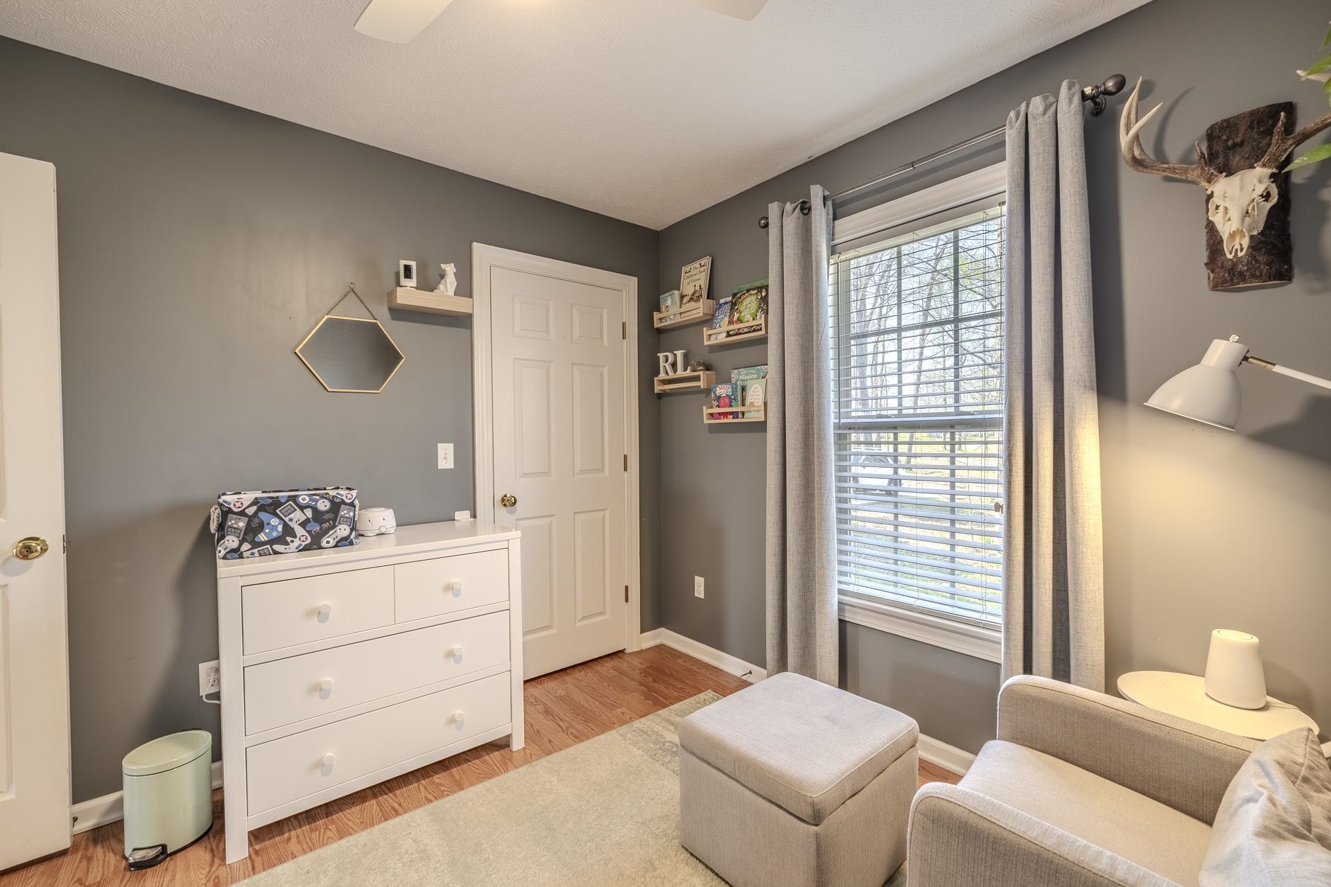 270 2 Boys Road Savannah, TN 38372 - Photo 24 of 35 Living area with light wood finished floors and a ceiling fan