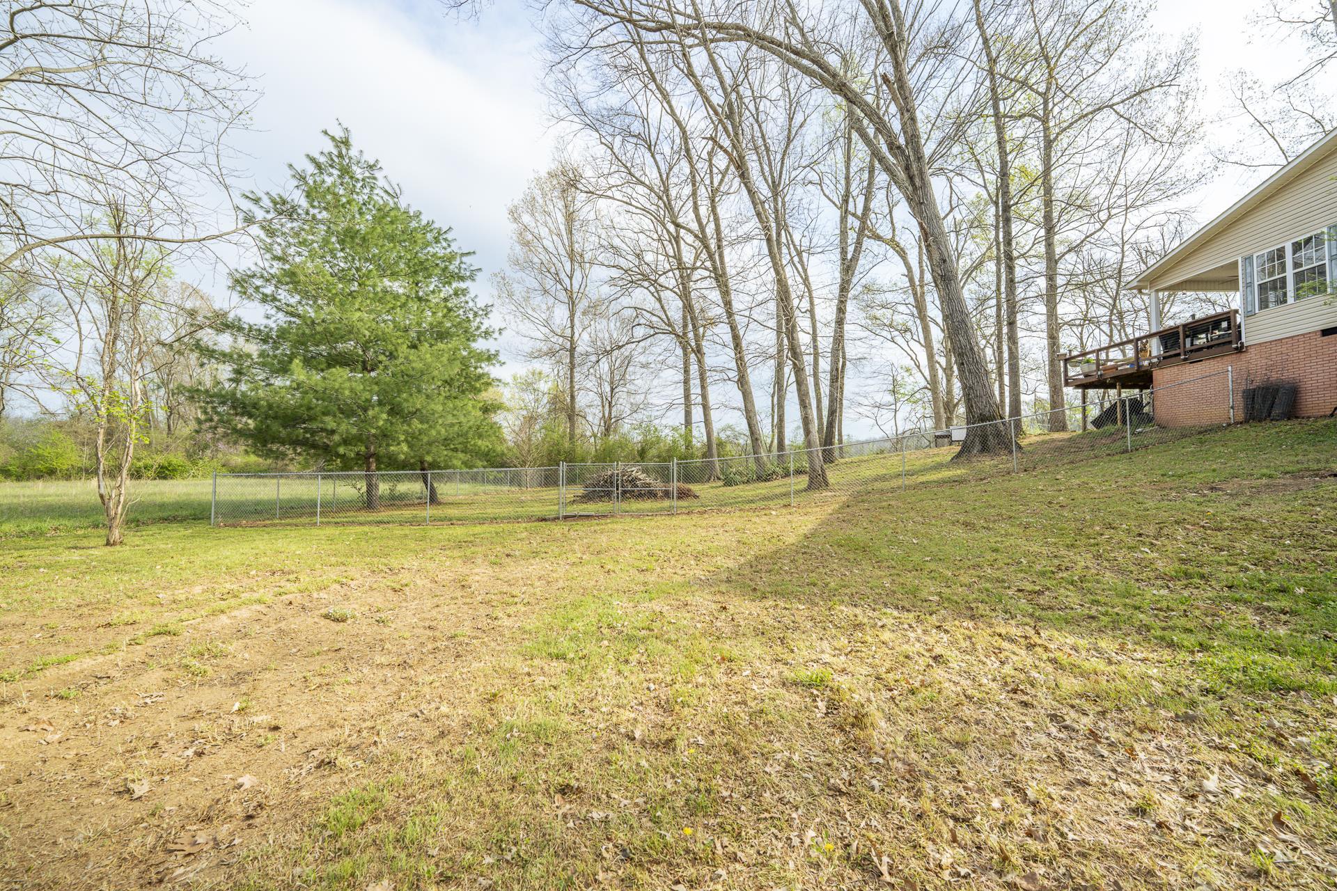 270 2 Boys Road Savannah, TN 38372 - Photo 31 of 35 View of yard with a wooden deck
