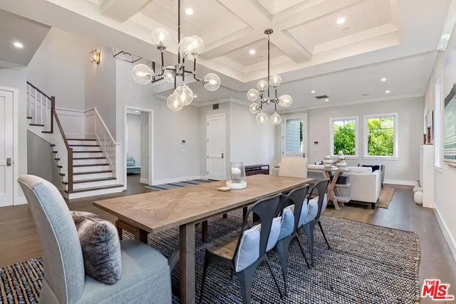 a view of a living room and a wooden floor