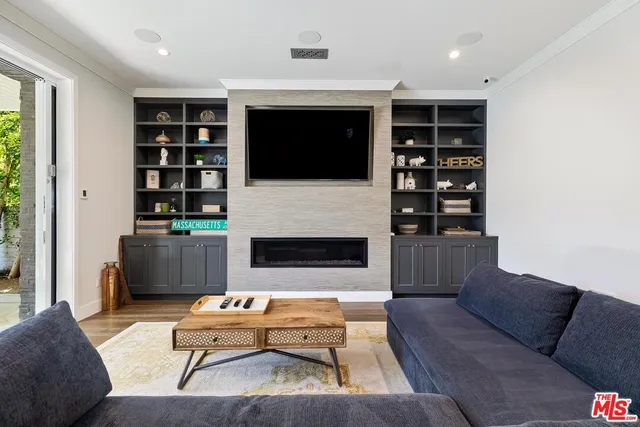 a living room with furniture and a rug