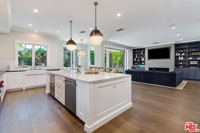 a large kitchen with stainless steel appliances kitchen island a large island in the center