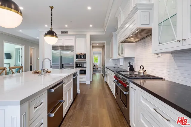 a kitchen with cabinets and car windows