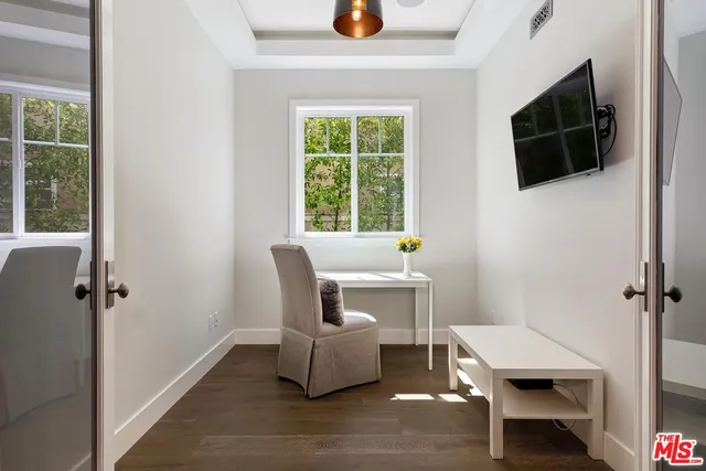 a large bedroom with a bed and a fireplace