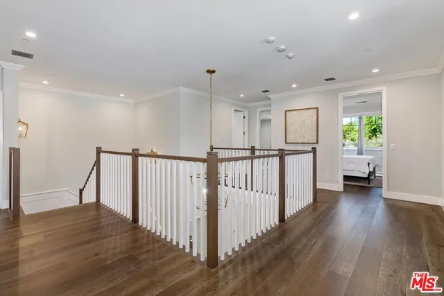 a spacious bedroom with a large bed and a flat screen tv