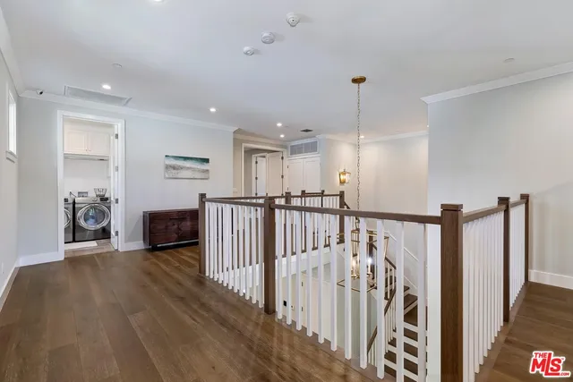 a spacious bathroom with a large mirror vanity and bathtub