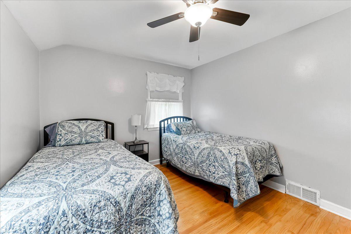 345 Holt Lane Springfield, PA 19064 - Photo 20 of 38 Second bedroom with wood floors and ceiling fan