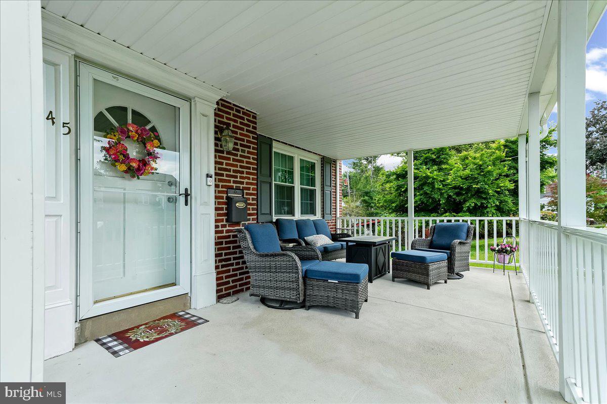 345 Holt Lane Springfield, PA 19064 - Photo 2 of 38 Charming porch with inviting seating.