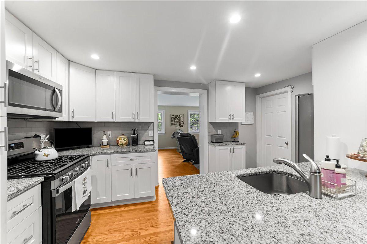 345 Holt Lane Springfield, PA 19064 - Photo 10 of 38 Updated kitchen opens to family room