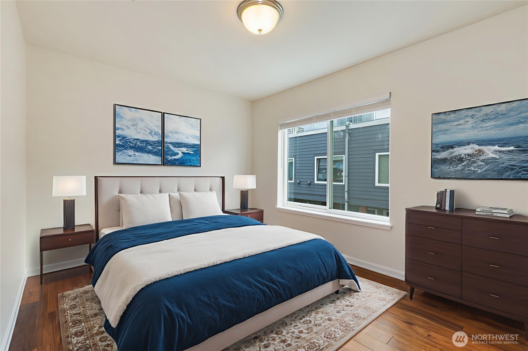 2440 Western Avenue, Unit 807 Seattle, WA 98121 - Photo 17 of 32 a bedroom with a bed and a window