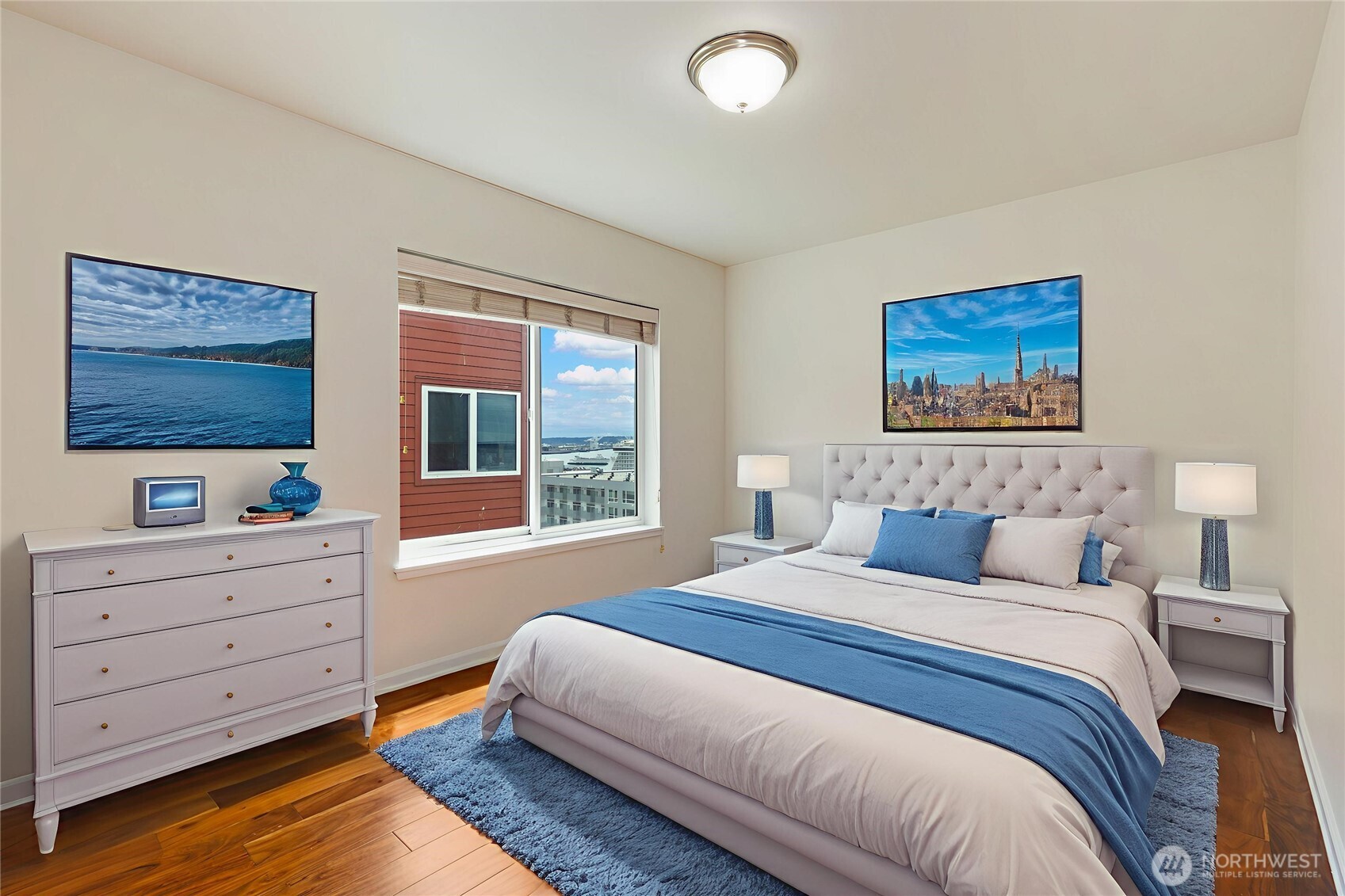 2440 Western Avenue, Unit 807 Seattle, WA 98121 - Photo 20 of 32 a bedroom with a bed and a window