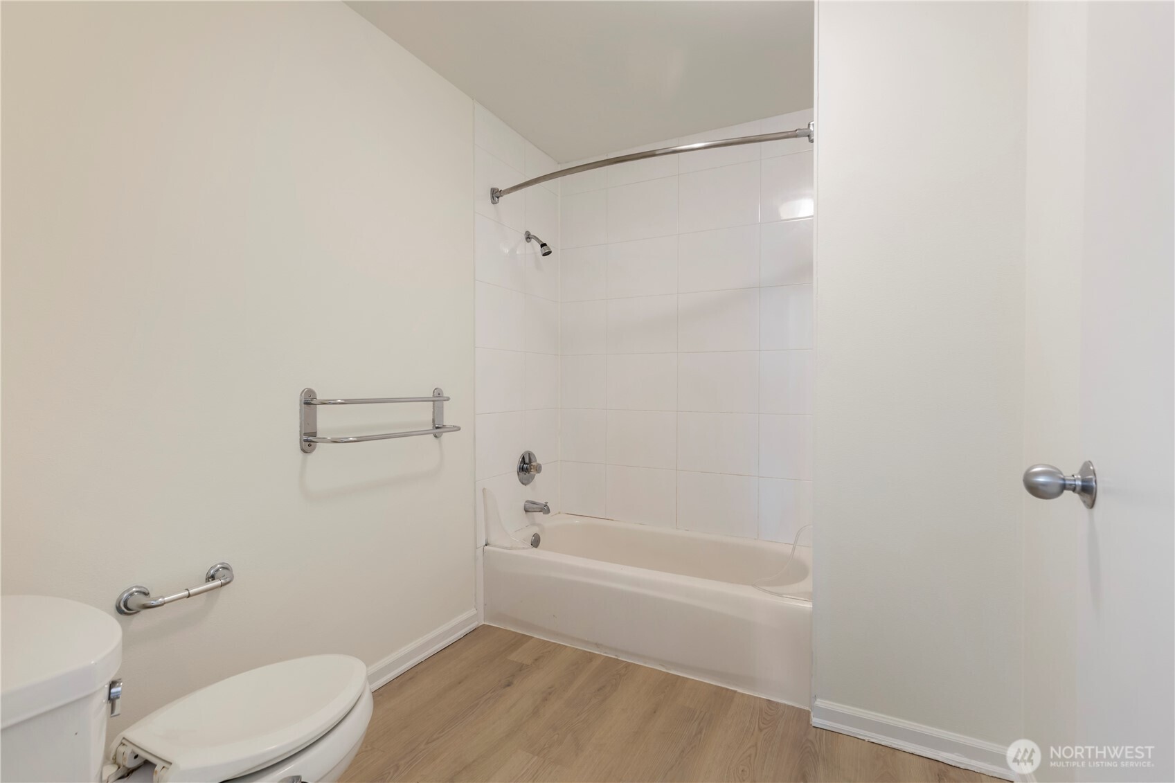 2440 Western Avenue, Unit 807 Seattle, WA 98121 - Photo 24 of 32 a bathroom with a toilet and shower