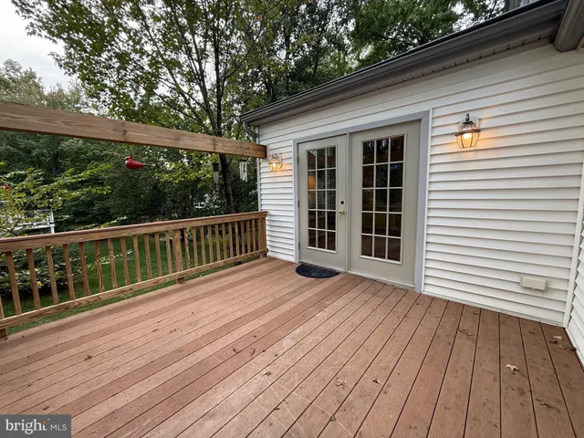 a view of a dining room with furniture wooden floor and chandelier