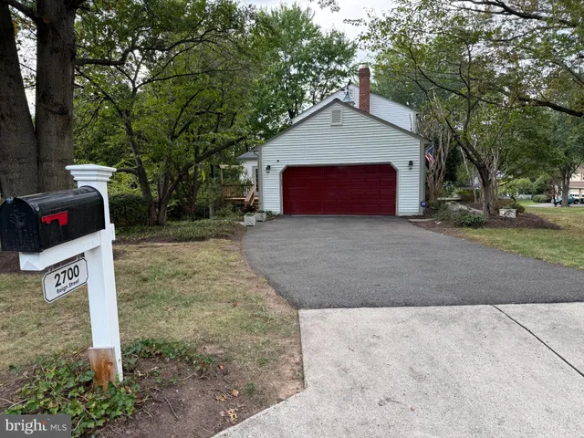 a view of a a dining room with furniture window and wooden floor