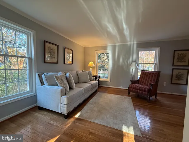 a kitchen with stainless steel appliances granite countertop a stove a sink a refrigerator and a microwave