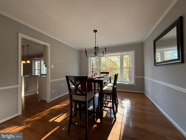 a living room with stainless steel appliances kitchen island granite countertop furniture and a kitchen view