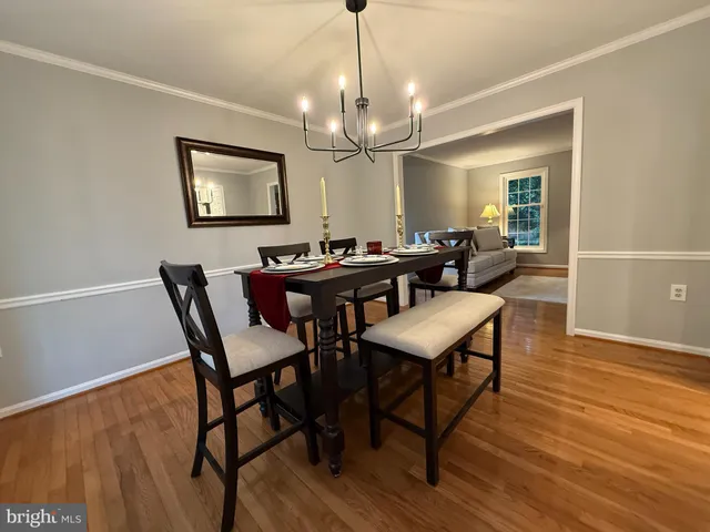a living room with furniture pool table and a large window